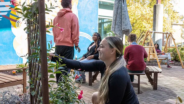 SIU Students work in a garden.