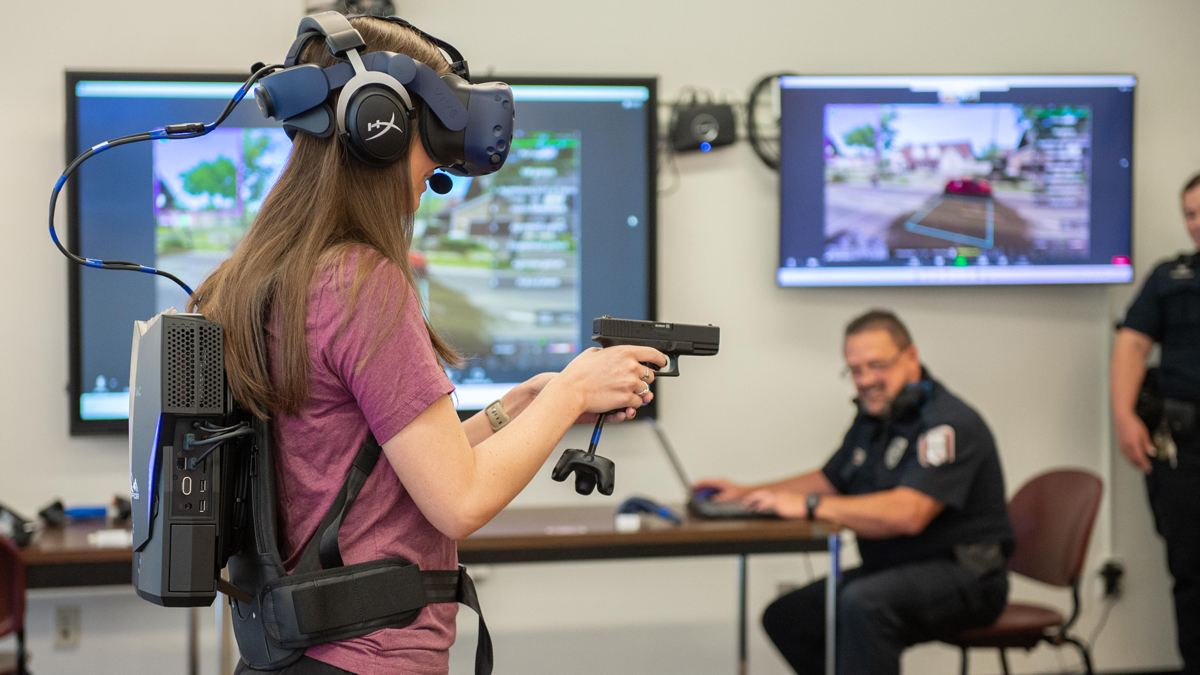 SIU Graduate student Jamie Stephens demonstrates virtual reality scenario