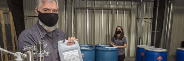 Fermentation Science Staff with Saluki Sanitizer