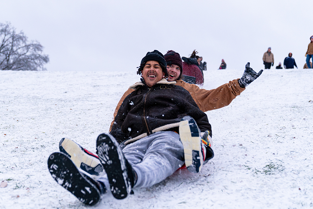 SIU students sledding on campus