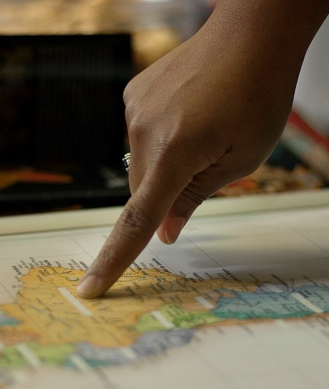 Finger Pointing at Map